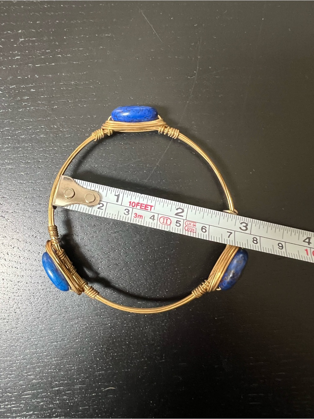 Bourbon and Bowties Gold-Tone Wire Bangle with Blue Stone Lapis
